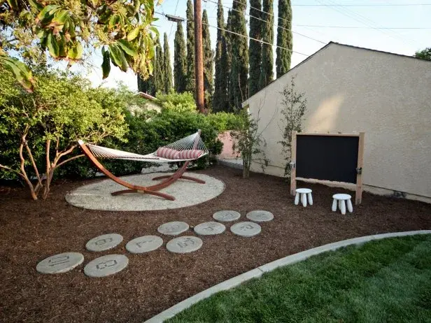 Backyard landscape with a hammock and stepping stones